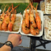 These grilled giant prawns are amazing. They're the size of my hand!