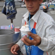 This is the traditional push cart vendor serving traditional coconut ice cream. They will also serve it in a hot dog bun. I caught this vendor at the end of his run so he was out of the buns. Only about 30 cents for this cup! Condensed milk and chopped nuts included.