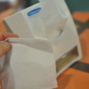 Typical napkin you'll find at restaurant. Single ply and small. Good for only a single wipe. Blowing your nose with it will cause a big hole and a mess on your hands. My tip: go to Starbucks and grab a handful of US grade napkins. McDonalds will only give you one napkin at the counter.