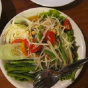 Som Tum or green papaya salad. For travelers a good rule of thumb is to always remember to order dishes and mention for less spicy. But never order a spicy dish as not spicy. This just completely ruins the overall taste.