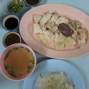 Khao Mun Gai or chicken with rice or Thai version of Hainanese chicken and rice or just plain good food. This dish is located in an area of Chiang Mai known for this specialty dish. There's several restaurants lining this block that serves this.